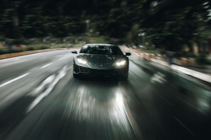 Grey coupe on road